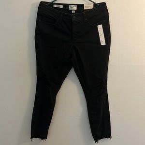 Black, straight cut, ripped jeans.